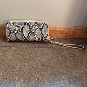 Snake print wallet with 12 card places, zipper pouch, and 3 compartments.